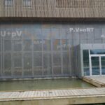 Siège social à Nantes — Bardage perforé inox brossé avec lettrage décoratif